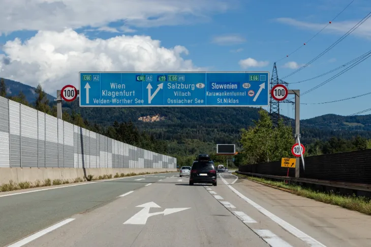 If you drive north through the tunnel, you will reach Villach in Austria on the other side.